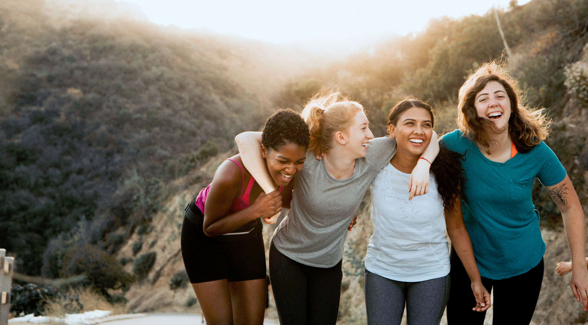 Women hiking together celebrating International Women's day